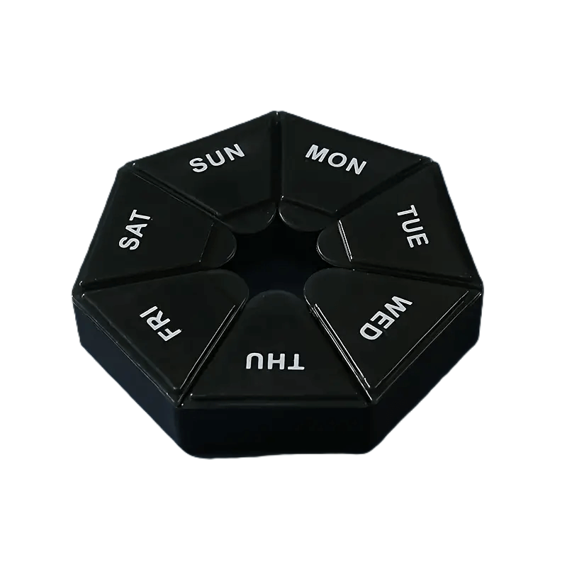 Zwarte pillenorganizer voor 7 dagen in cirkelvormig ontwerp met dagmarkering (ma t/m zo)