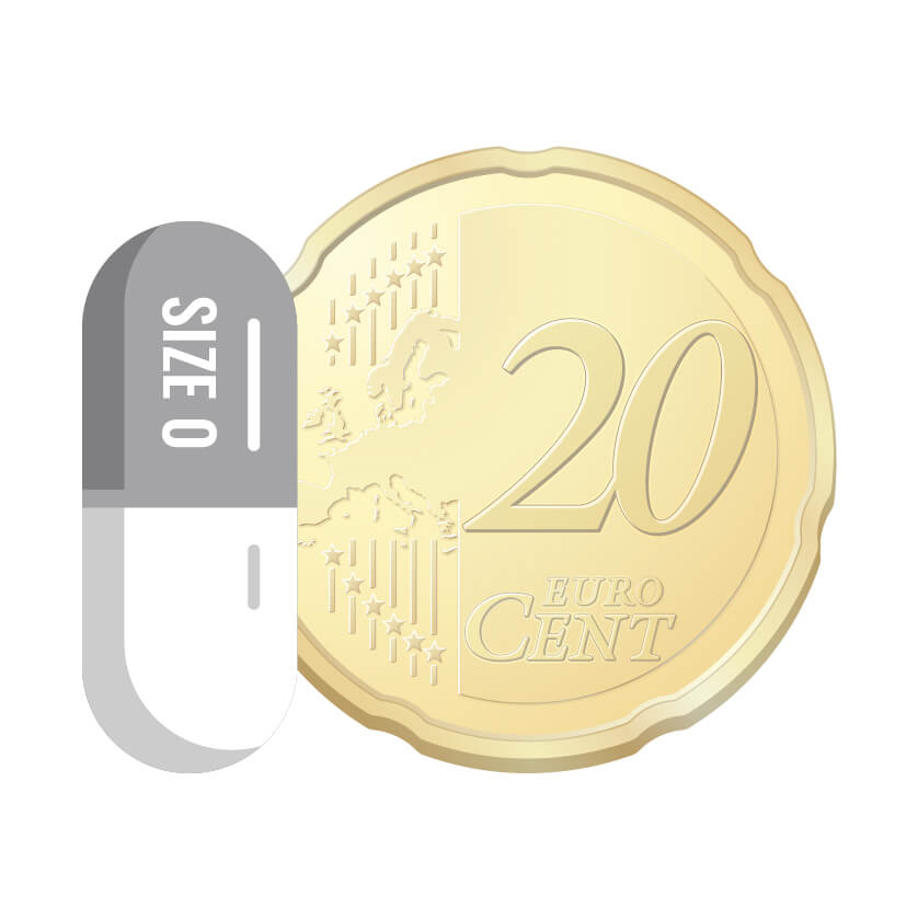 Transparante lege capsule maat 0 naast munt voor duidelijk beeld van afmetingen